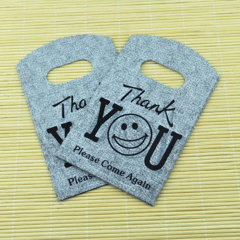 Wholesale 50Pcs/Lot Plastic Bag 9x15cm Small Boutique Storage Candy Jewelry Packaging Bag Plastic Gift Bags With Handle